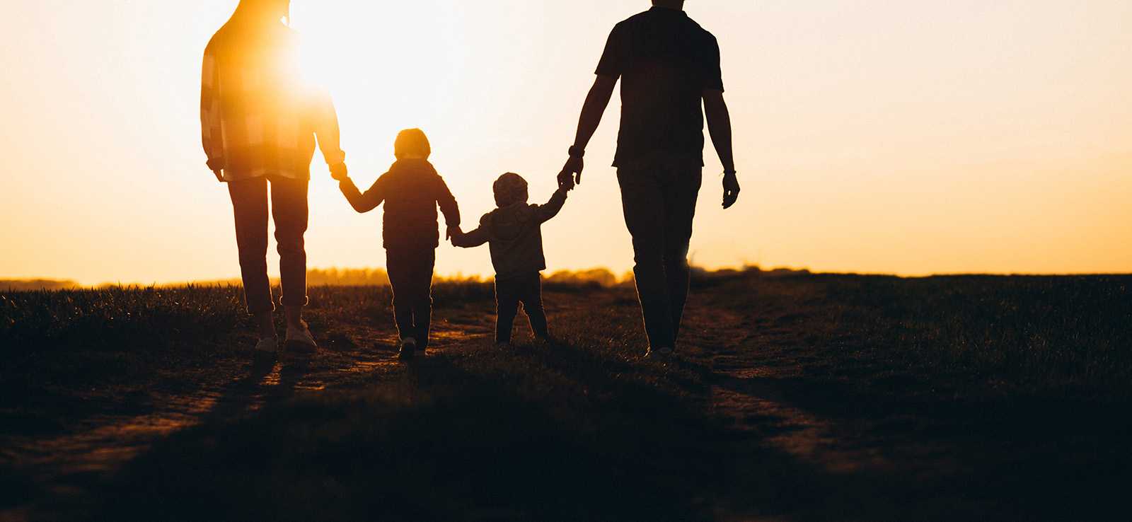 Happy family silhouette on the sunset